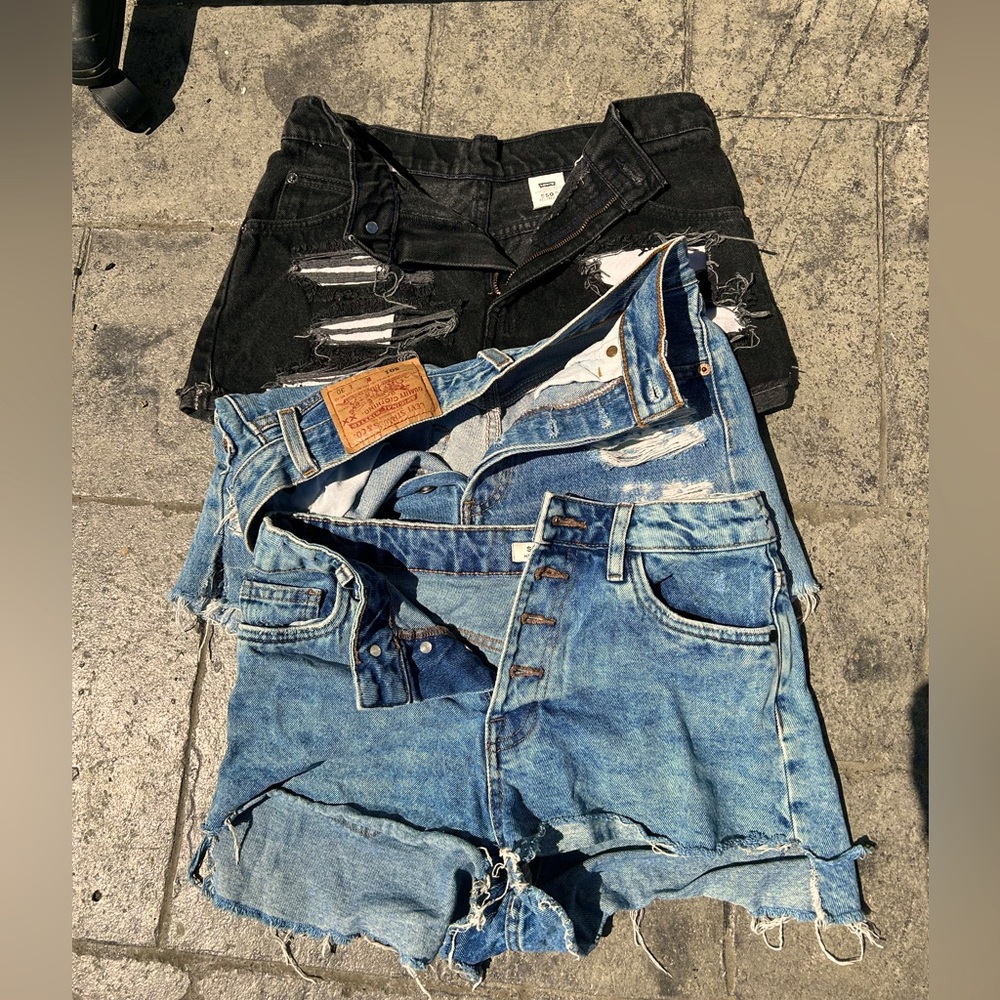 A bundle of jeans shorts one black and two blue